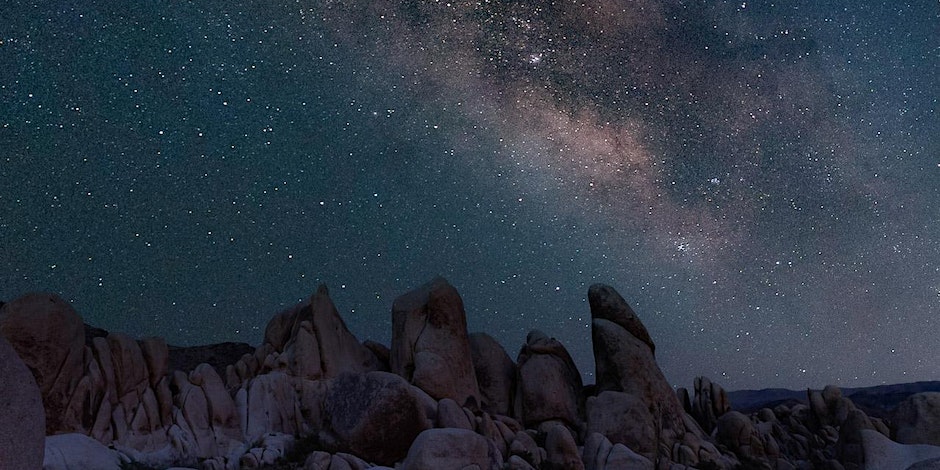 The Milky Way above a large rock formation in Joshua Tree National Park. Picture by Jon Norris
