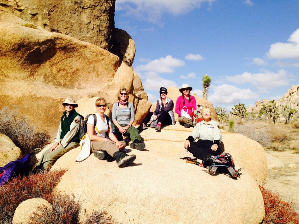 Group of women on a large boulder in Joshua Tree National Park